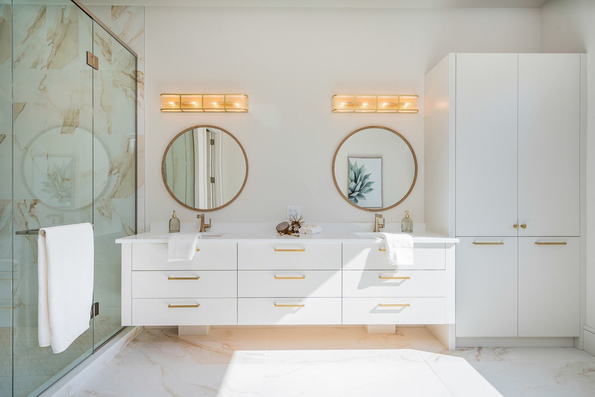 Custom bathroom vanity with dual sinks and modern lighting, designed by Homestead Woodworks for a luxurious and functional bathroom
